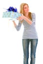 Interested teengirl shaking present box Royalty Free Stock Photo