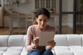 Interested young hispanic woman using digital computer tablet. Royalty Free Stock Photo