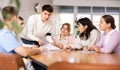 Interested young student taking part in group discussion Royalty Free Stock Photo