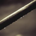 Interesting abstract water drops on a black and white metal tube Royalty Free Stock Photo