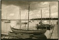 Old paper photography with vintage wooden boats in Roskilde, Denmark