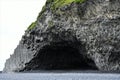 An interesting cave and a  formation of lava in the form  pillars at the south coast of Island Royalty Free Stock Photo