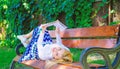 Interesting book. Smart and pretty. Smart lady relaxing. Girl reading outdoors while relaxing on bench. Girl lay bench Royalty Free Stock Photo