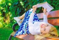 Interesting book. Woman spend leisure with book. Lady smiling face enjoy rest. Girl reading outdoors while relaxing on Royalty Free Stock Photo