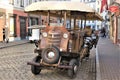 Riga, Latvia, November 2019. Strange pedal tourist car in the center of the old city.