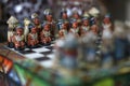 Interesting chess pieces on a chessboard Royalty Free Stock Photo