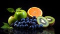 An interesting composition with blueberries, grapefruit and kiwi on a black background that emphasi Royalty Free Stock Photo