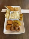 Interesting and delicious Venezuelan food composed of llanero cheese, arepas, empanadas, green plantain and fried cheese