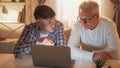 Interesting movie family laisure father son laptop Royalty Free Stock Photo