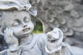 An interesting photo of a small cherub statue