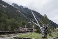 Interesting shot of an old abandoned railway station with rusty metal constructions and trains Royalty Free Stock Photo