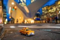 Interesting shot of an old yellow taxi toy in New York City, USA