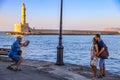 Interesting site of man taking photo of young couple in Chania