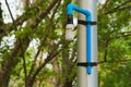 An interesting solution to repairing a high and unreachable, broken, Thai park light pole, using simple materials.