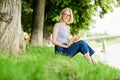 Interesting story. Relax and get new information. inspired by novel author. student girl with book outdoor. woman in Royalty Free Stock Photo