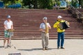 Uglich, Russia, July 9, 2023. Street musicians on the city pier.