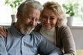 Happy retired family couple embracing spending time for pleasant conversation