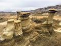 An interesting and unique view of the hoodoos outside of Drumheller, Alberta, Canada. A hoodoo is a tall, thin spire of rock Royalty Free Stock Photo