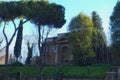 An interesting and very old house hides behind the trees. Roma. Italy Royalty Free Stock Photo