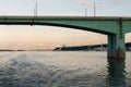 Yaroslavl, Russia, July 8, 2023. View of the river and embankment at sunset through the bridge truss.