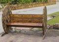 Interesting wooden bench in the city Park in natural light