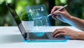 The interface hovers above a sleek laptop, which is open and emitting a soft, blue glow. The flowchart depicts various icons and Royalty Free Stock Photo