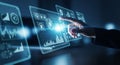 Close-up of a human finger touching a glowing blue digital interface displaying financial charts and data analytics Royalty Free Stock Photo