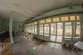 The interior of an abandoned building full of garbage, furniture and glass left by users. Urbex Royalty Free Stock Photo