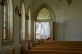 Crosses on curtains inside abandoned church in prison yard