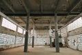 Interior of an abandoned industrial building with columns Royalty Free Stock Photo