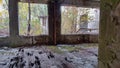 A interior of abandoned old building many years after nuclear powerplant explosion