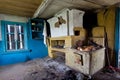 Interior of an abandoned Russian rural house, Russian stove Royalty Free Stock Photo