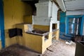 Interior of an abandoned Russian rural house, Russian stove Royalty Free Stock Photo