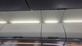 Interior of airplane cabin ceiling and overhead storage bins Royalty Free Stock Photo