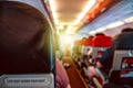 Interior of an airplane with passengers on seats waiting for takeoff Royalty Free Stock Photo