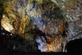 Dark, colorful and lighted interior of the cave of Algar de CarvÃÂ£o, Terceira - Azores PORTUGAL Royalty Free Stock Photo