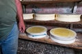 Interior of an alpine hut with typical forms of local cheese Royalty Free Stock Photo