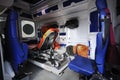 Interior of an ambulance car: stretcher, bags, medical equipment