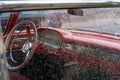 Interior of an American classic car through the side window with many raindrops. Royalty Free Stock Photo