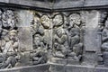 Interior of ancient Borobudur temple lower terraces. Close up of detail a stone relief on the wall. Royalty Free Stock Photo