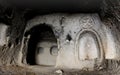 Interior of ancient cave christian temple with image of cross cut on the wall, Soganli ,Cappadocia, Turkey Royalty Free Stock Photo
