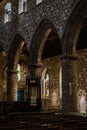 Interior of Ancient Church Cathedral with pillars, arches, and stained glass windows in Scotland, UK Royalty Free Stock Photo