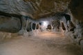 The interior of an ancient underground city on the territory of Cappadocia. Rooms deep underground. The concept of tourism and