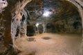 The interior of an ancient underground city on the territory of Cappadocia. Rooms deep underground. The concept of tourism and