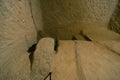 The interior of an ancient underground city on the territory of Cappadocia. Stone hatch, defense system, blocking the passage..