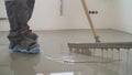 Interior of apartment under construction. Mirror smooth surface of the floor. Floor covering with self leveling cement mortar. Royalty Free Stock Photo