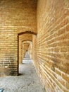 The interior arched corridor of Allahverdi Khan Si-o-Seh Pol historical bridge in Isfahan , Iran