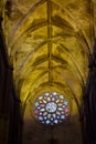 Interior arches and colored rose window of Sevilla Cathedral