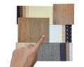 interior architect selects material samples for renovation including luxury blackout drapery fabric catalog chart