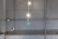 Abstract loft interior of concrete grey ceiling with air ventilation and security camera. Interior architecture and